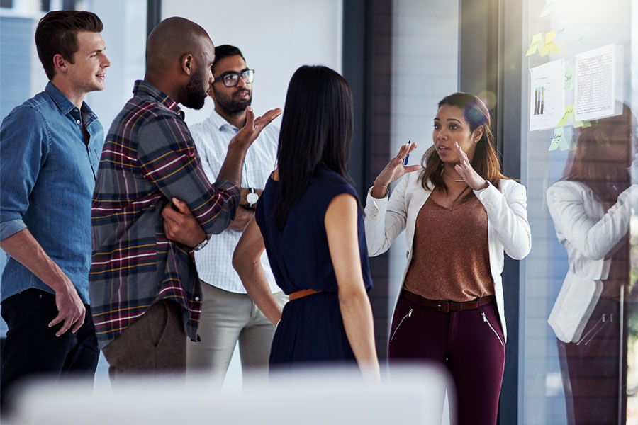 Woman speaking to co-workers