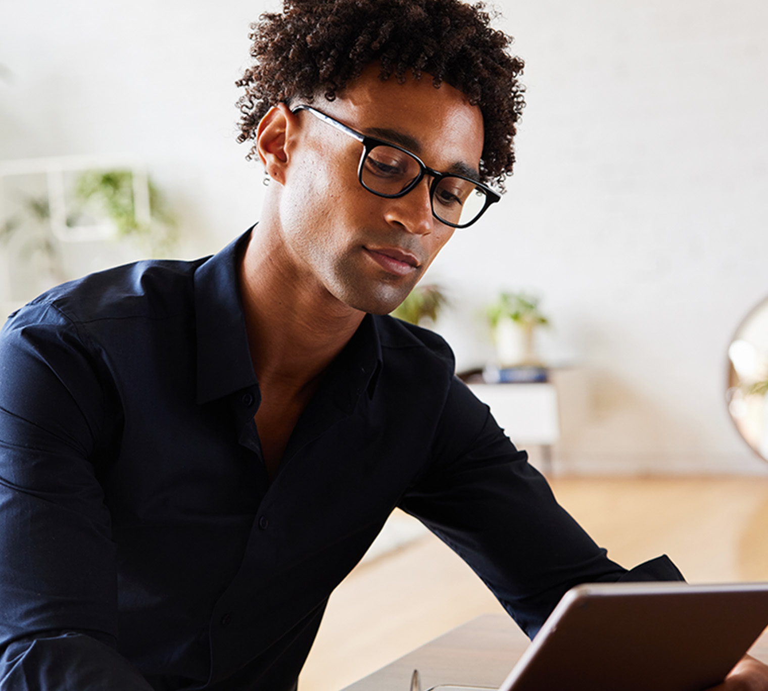 man looking at tablet