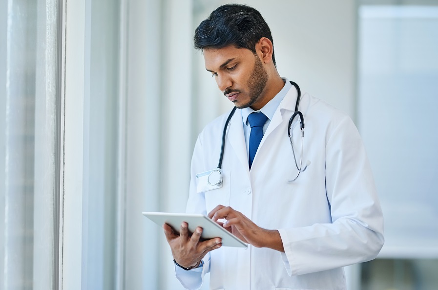 Doctor working on tablet