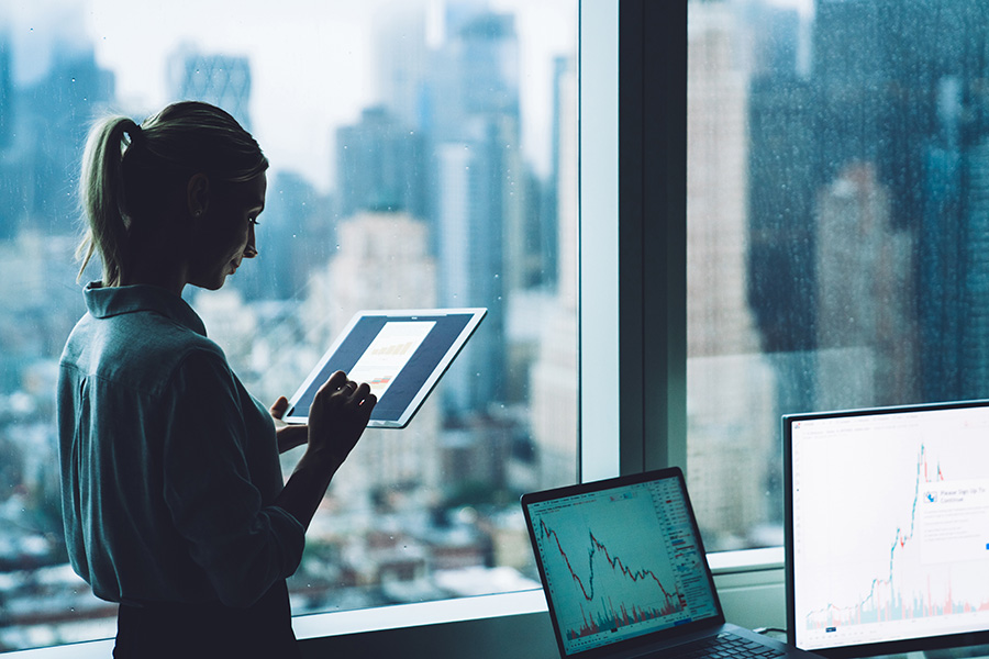 Woman working on tablet in office