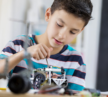 Child building a robot