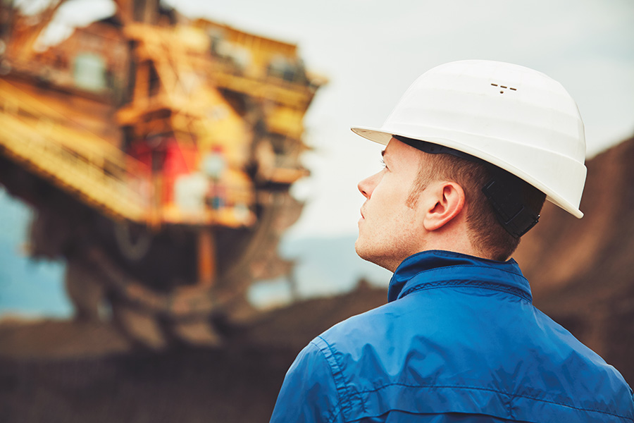Man in hard hat at mining site