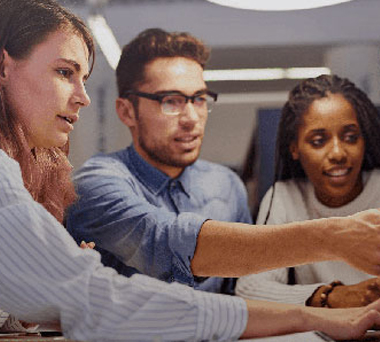 Three people conferring during a meeting