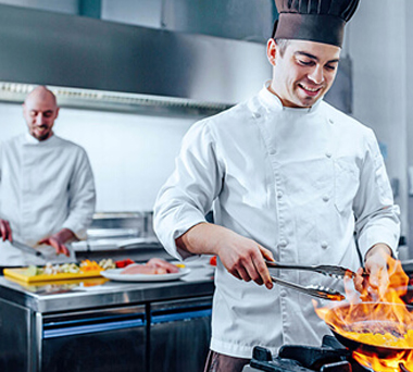 Two chefs working in kitchen