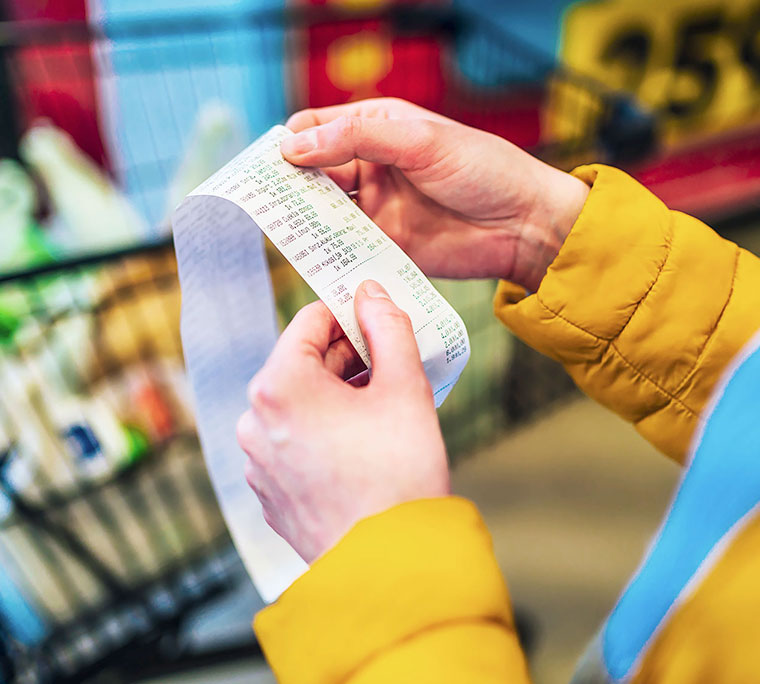 Checking grocery receipt after payment