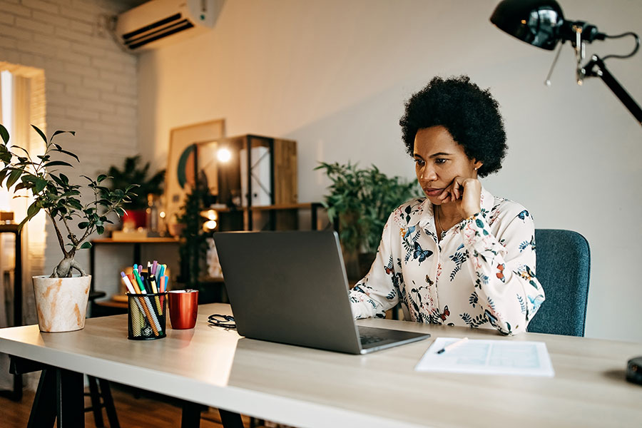 Woman working on laptop at home