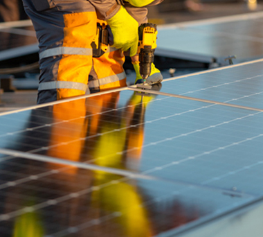 Worker constructing solar panel