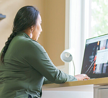 Indigenous woman working on computer