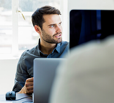 Man working on laptop in office