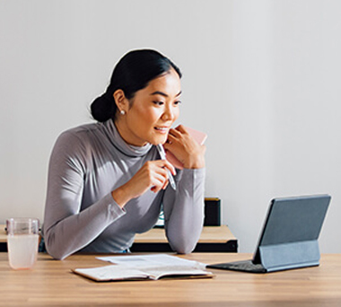 Woman working from home in a virtual meeting
