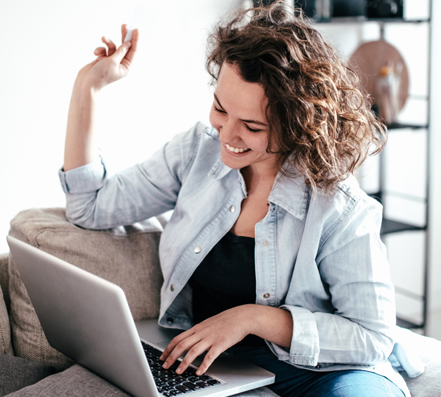Happy woman in living room on virtual call.