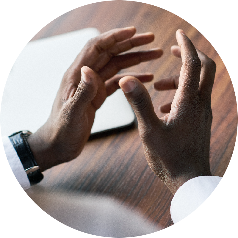 hands over a desk looking like they are engaged in conversation