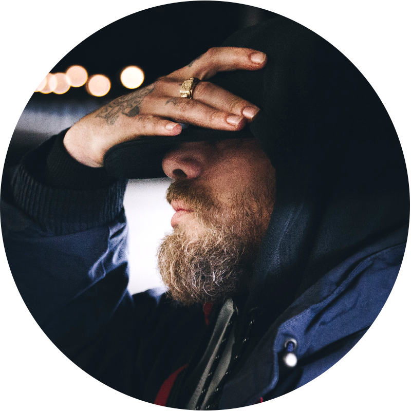 person covering face with hand looking disappointed