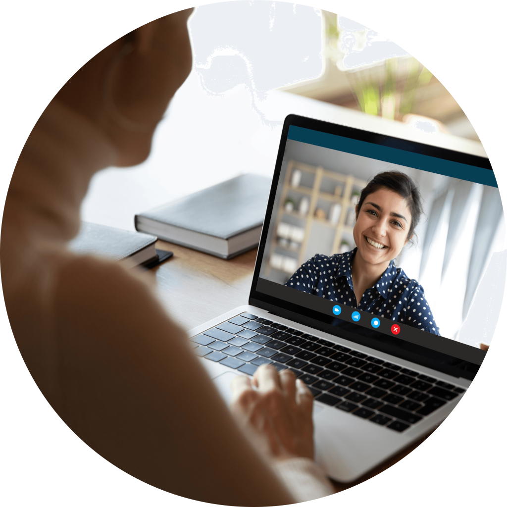 Person working from home on their laptop on a video call with a coworker