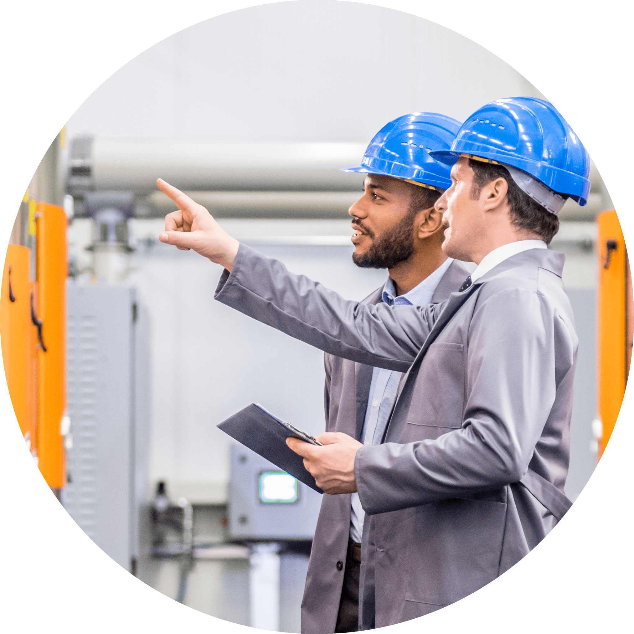 Two people discussing wearing hard hats