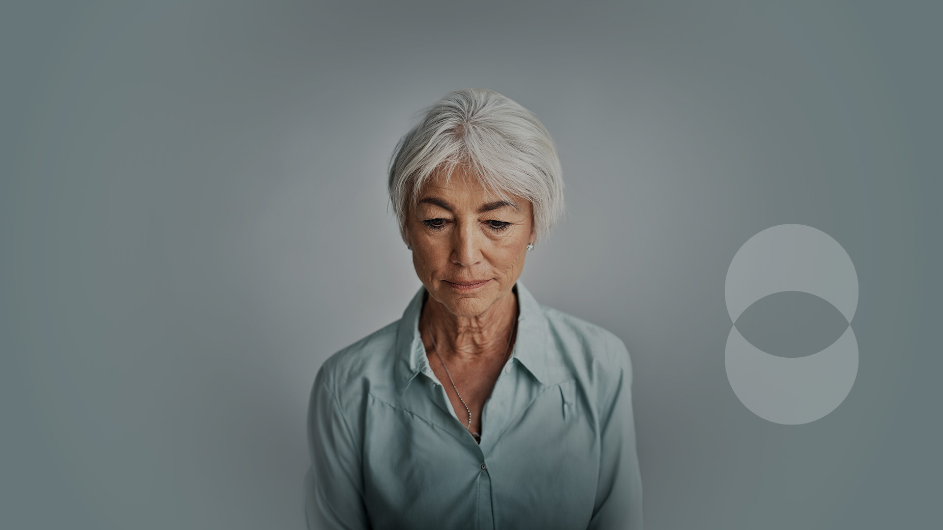 Elderly person with a far off look in their eyes.