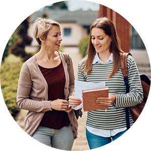 two women walking after class