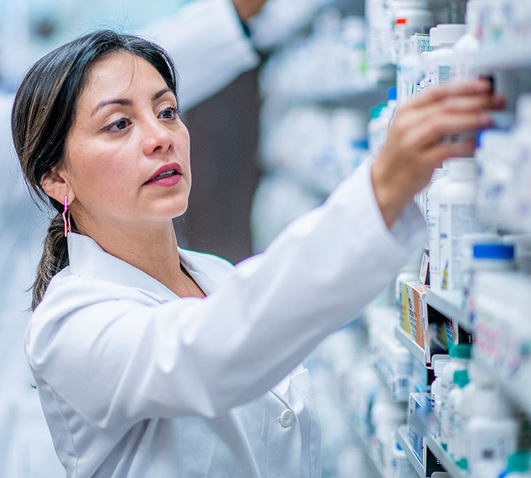 a pharmacists looking for medication off the shelf.