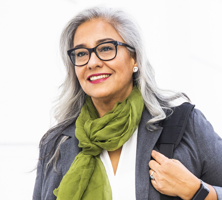 Confident business woman walking in office building