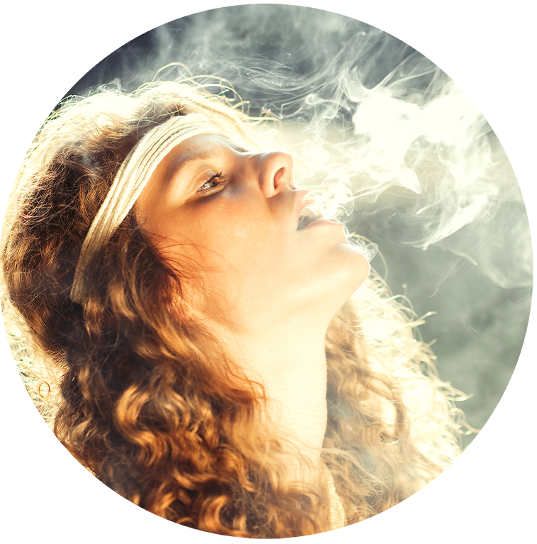 girl blowing smoke.