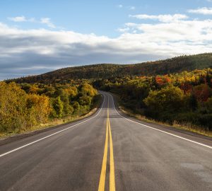 Scenic highway during a vibrant sunny day in the fall season. Taken in Newfoundland, Canada.