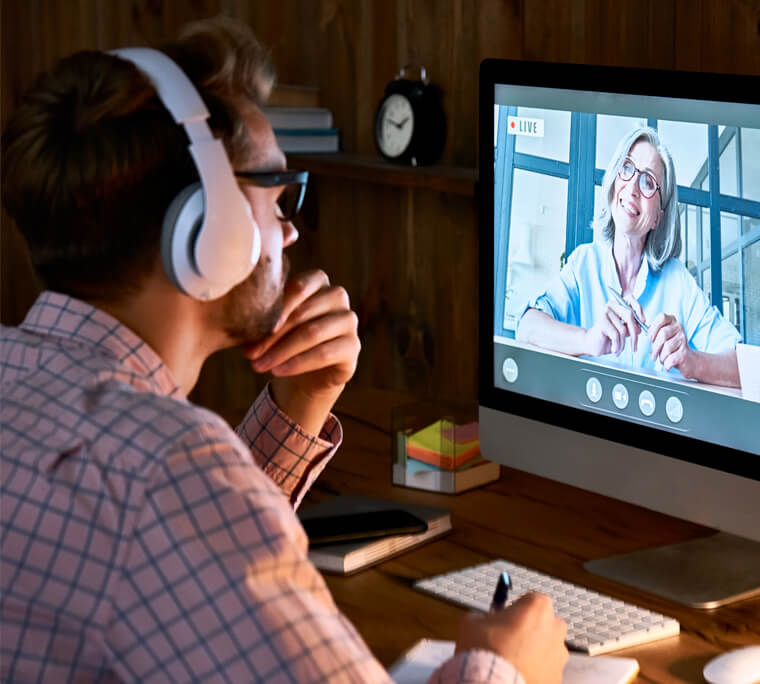 Man wearing headphones in virtual meeting