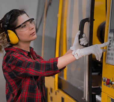 Woman operating machinery