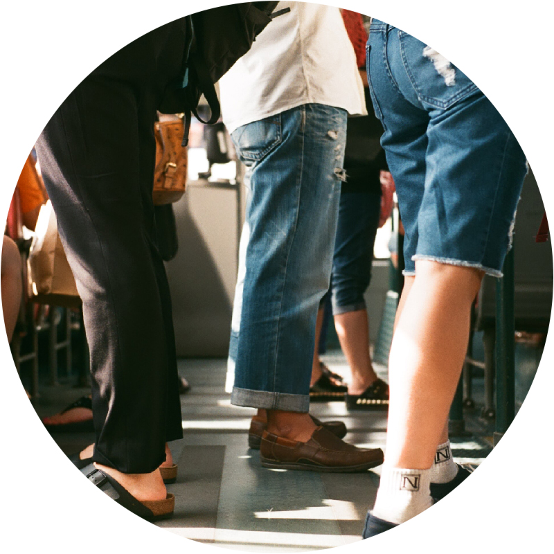 Close-up of people standing on bus