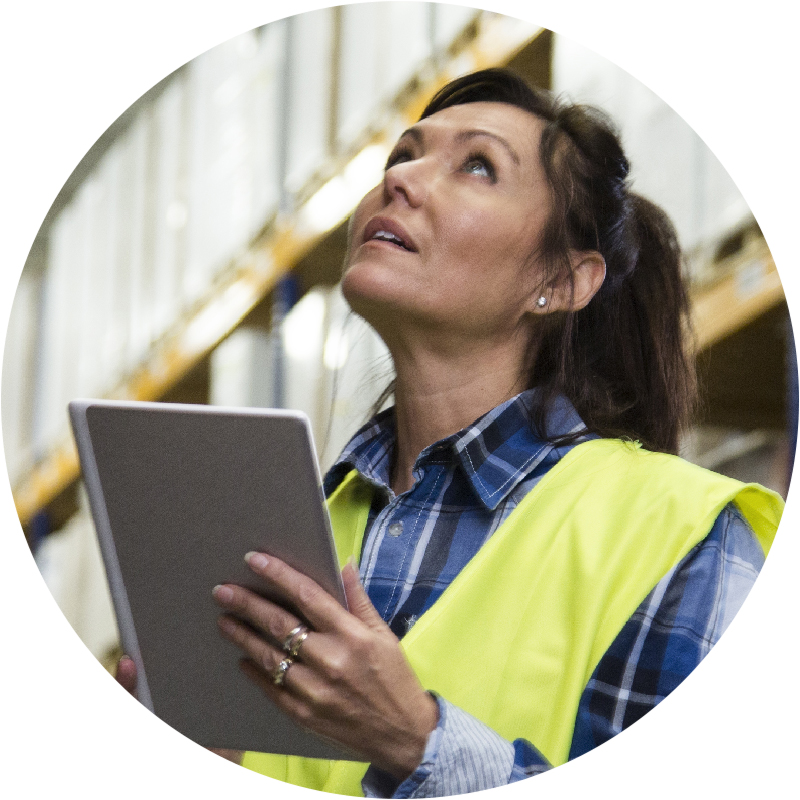 Worker taking inventory in warehouse
