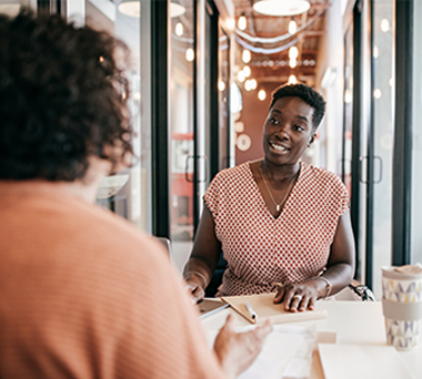 People at a meeting in a cafe