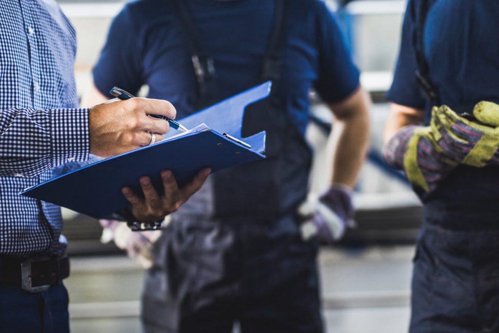 Person instructing workers on the job