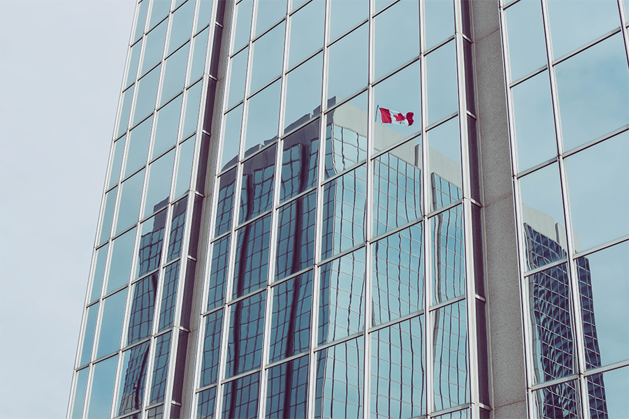 Office building reflected in glass office building