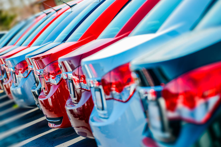 Row of new cars in a lot