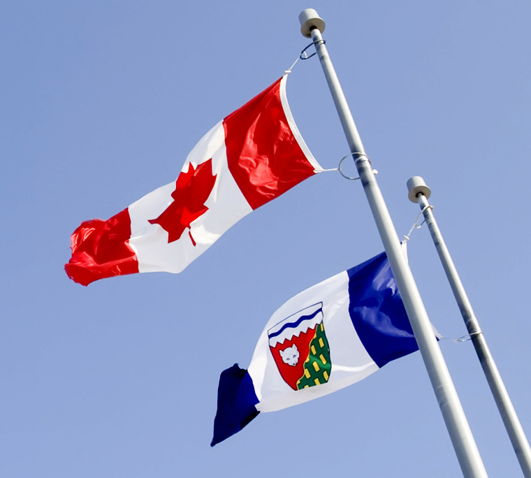 Canada flag and flag of the Northwest Territories in sky