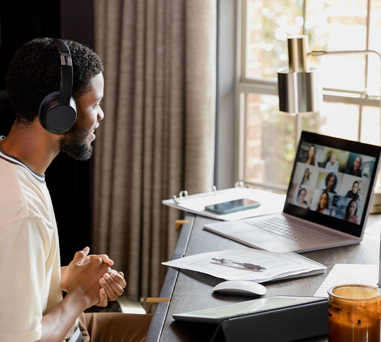Man on a video call with many of his coworkers