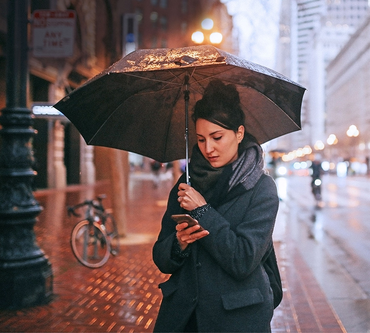 Young commuter person checking their smartphone