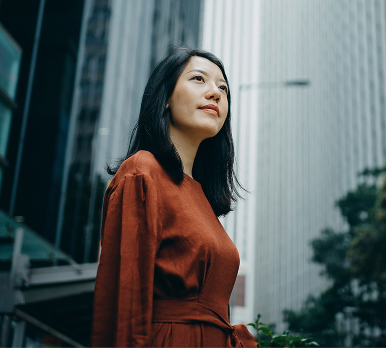 person looking up in the middle of the streets.