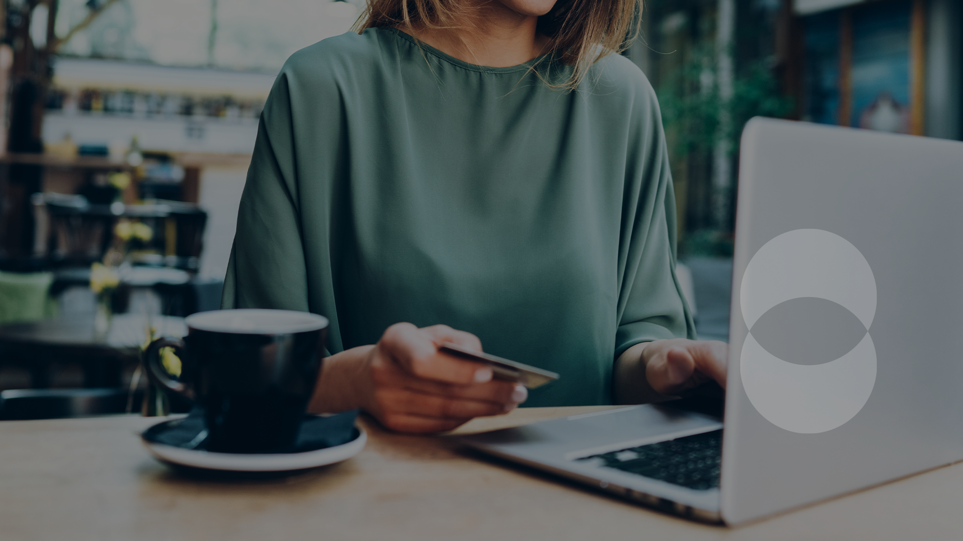 a woman is paying with her credit card while online shopping