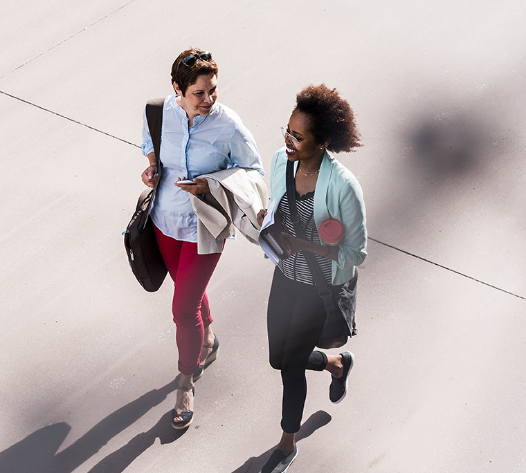 Two women walking to work